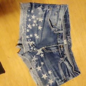 Star covered jean shorts